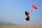 Red umbrella woman jump to Blue sky