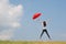 Red umbrella woman jump to sky