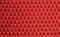 Red upholster material close-up