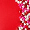 Red Valentines Day background with candy heart border