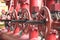 Red valves on metal pipe. Valve is a device that regulates, directs or controls the flow of a fluid like gases, liquids by opening