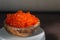 Red vegan caviar from kelp seaweed in a wooden bowl. Valuable and useful product for a healthy diet. Superfood. Close-up