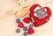 Red Velvet cake on wooden background, Shape of heart, raspberries.