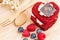 Red Velvet cake on wooden background, Shape of heart, raspberries.