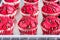 Red Velvet Muffins / Cupcakes on a Baking Tray Close Up Photo.