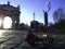 Red vespa parked in front of arco della pace Milan Italy