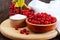 Red viburnum in a ceramic bowl, sugar, a bunch of berries for tea