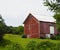 Red vintage country barn with gable roof