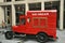 Red vintage ice cream selling car in the city center of London, England