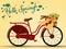 Red vintage ladies bicycle with wicker basket full of spring flowers viewed from the side and Hello Spring! text