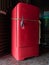 Red vintage refrigerator tied with rope