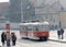 Red vintage tram and people waiting