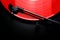 Red vinyl record spinning on a turntable - directly above