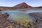 Red volcano near Los Hervideros caves in Lanzarote, Canary Islands.