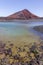 Red volcano near Los Hervideros caves in Lanzarote, Canary Islands.