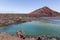 Red volcano near Los Hervideros caves in Lanzarote, Canary Islands.