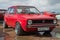 Red Volkswagen Golf first generation (1973 model year) at the exhibition and parade of vintage cars