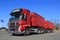 Red Volvo FH Truck with Full Trailer and Blue Sky