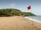 Red warning flag at Palolem beach during off season,southern Goa,India