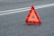 Red warning triangle on the carriageway with a double dividing strip