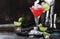 Red Watermelon alcoholic cocktail with vodka, juice, lime and crushed ice, metal bar tools, dark background