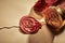 Red wax seal with the face of Father Christmas sealing a decorative vintage letter and envelope in a close up view with the brass