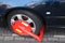 Red wheel clamp around the tyre in Den Haag the hague for wrong parked cars in the City, to be paid the fine first