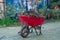 Red Wheelbarrow filled with leaves