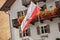 The red and white Alto Adige regional flag is on the wind during the local celebration