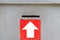 Red and white arrow sign on the box have a money compartment for pay a fish food