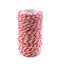 Red and white baker`s twine spool for packaging mail box isolate