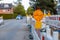 Red and white barricades with warning lights at a street in the