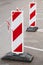 Red and white barrier signs