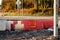 Red and white barriers on a road repair site to constrain public movement for their safety. Security measures on a construction