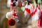 Red and white beautiful martisor balls closeup hanging on the branches of the tree