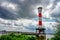 Red and white Blankenese lighthouse near Hamburg. Historic lighthouse on the Elbe