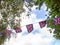 Red, white and blue festive bunting flags against sky background. Union Jack, UK flags blowing in the wind. Brexit maybe