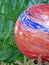 Red, White and Blue Glass Garden Orb or Ball in Green Grass