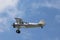 Red, White, and Blue Stearman Airplane Flying