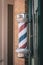 A red white and blue striped barbers pole