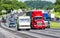 Red, White, and Blue Trucks on the Interstate