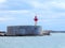 Red and white breakwater lighthouse