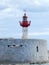 Red and white breakwater lighthouse