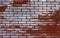 Red and white brick background. The texture of an old worn brick wall. Grunge background. Seamless interior texture old brick wall