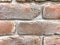 Red and white brown stone background, stand wall pattern texture. Brickwork. Construction made of bricks