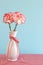 Red and White Carnations in a Vase