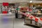 Red and white caution tape restrict shelves and booth area inside store in Germany during COVID-19.