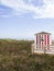 Red and White changing house on the beach