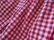 Red and white checkered background with striped squares for picnic blanket, tablecloth, plaid, shirt and textile. Fabric