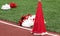 Red and white cheerleading megaphone and pop poms